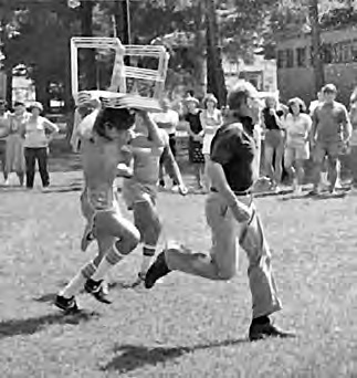 Bro. Bob defeating an “encumbered” runner in a foot race.